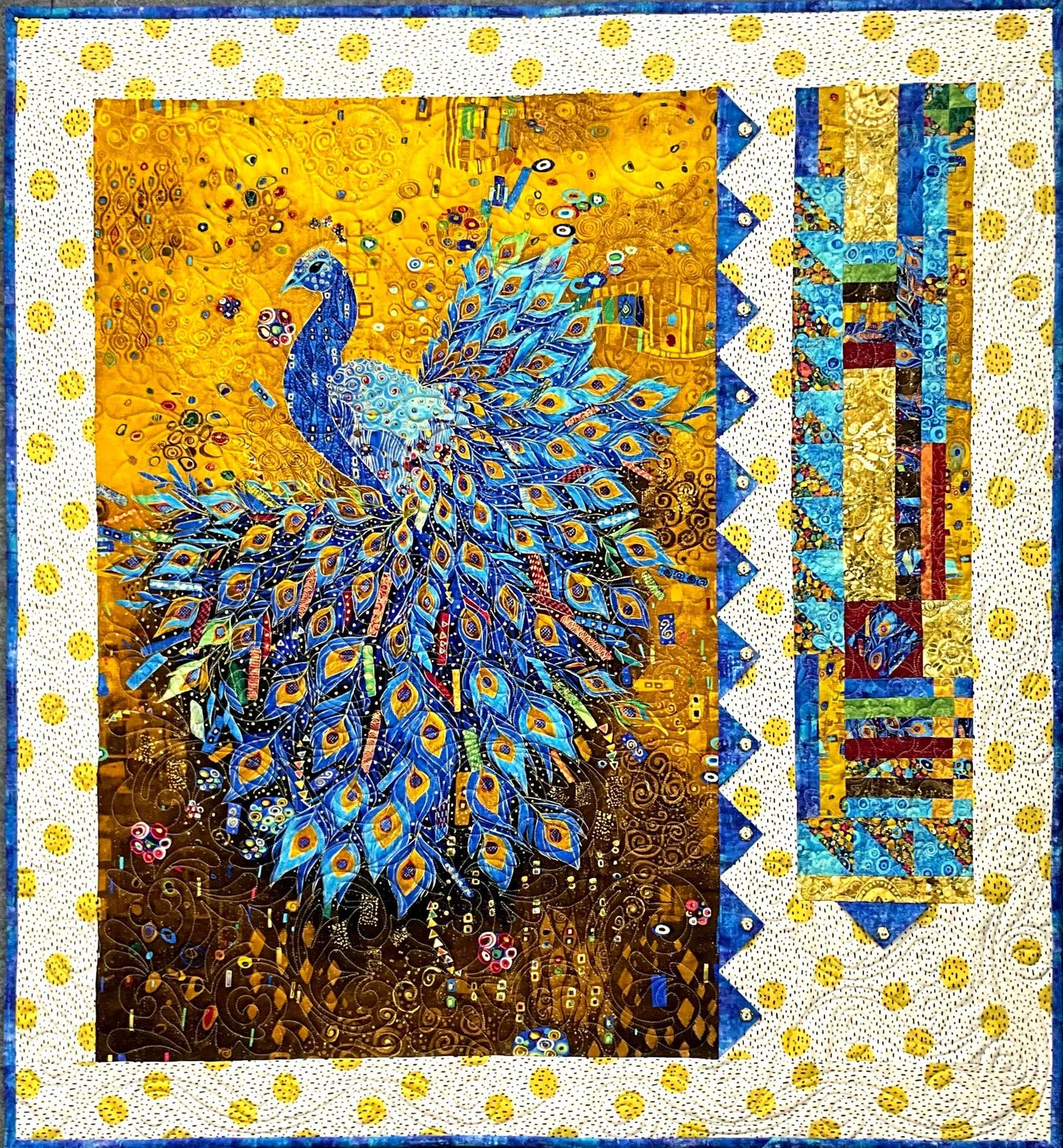 Majestic Peacock: Quilted Wall Art by Mary Cantore features a vibrant blue peacock with a detailed tail on a yellow floral background, bordered in blue, yellow, and gold patchwork—a stunning decor piece for any home.
