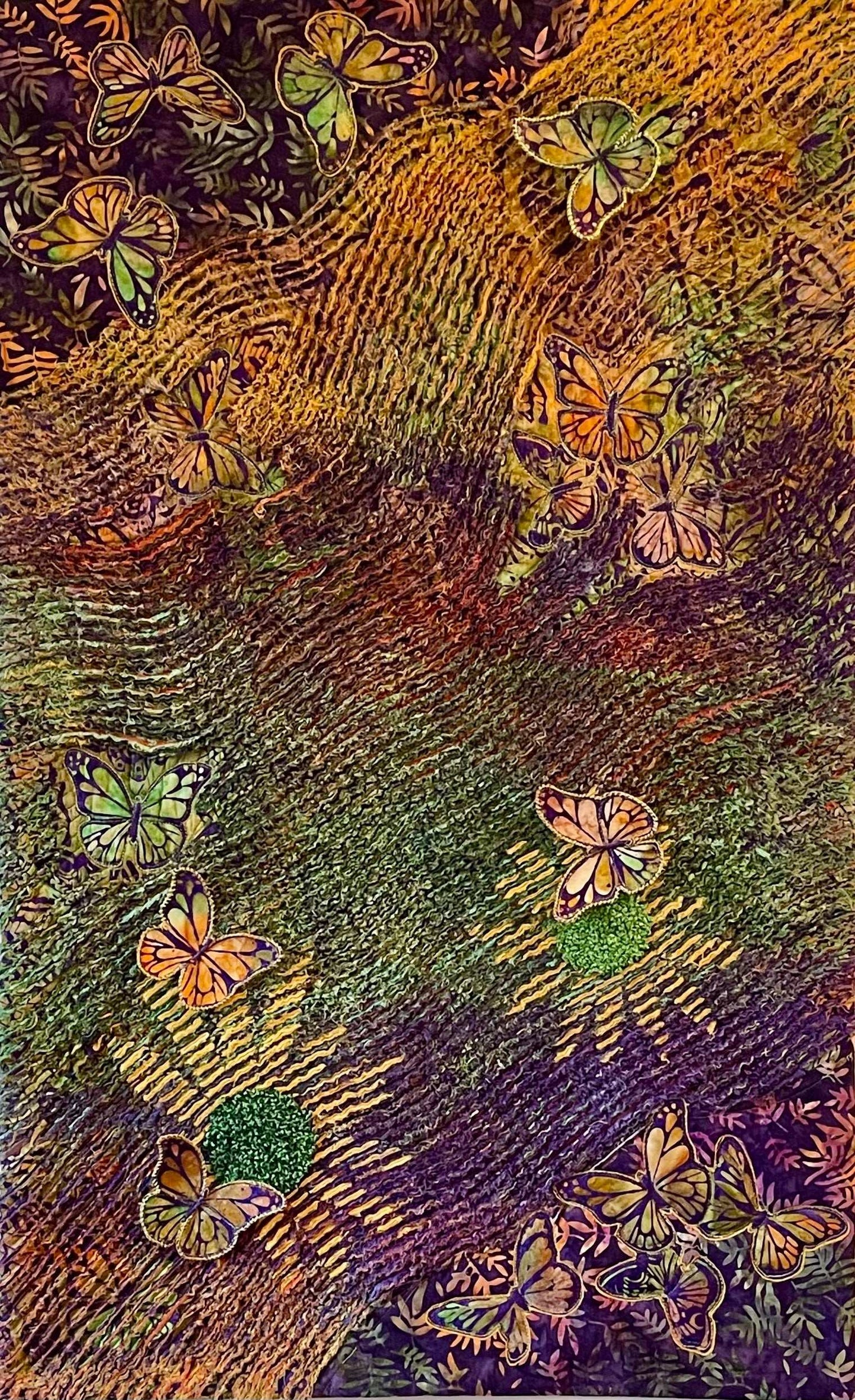 Butterfly Garden: A Textile Art Wall Hanging by Miki Howell features colorful, abstract butterflies with vibrant wings on textured, wavy green, yellow, purple, and orange patterns—bringing the lively spirit of a butterfly garden to your space.