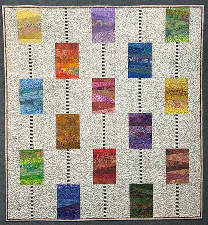 Stringed Beads: Quilted Wall Art by Mary Cantore features vertical rows of colorful rectangular blocks with horizontal stripes on a light patterned background, separated by black and white striped sashing. Ideal as a wall hanging or lap quilt.