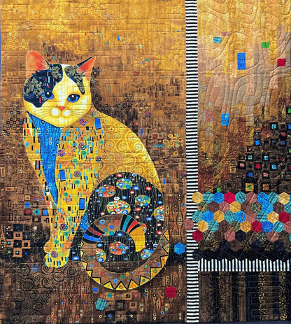Cleo: Quilted Wall Art by Mary Cantore features a sitting cat with a detailed, patterned body and tail against a glowing golden mosaic background, striped column, and custom patchwork quilting inspired by Gustav Klimt.