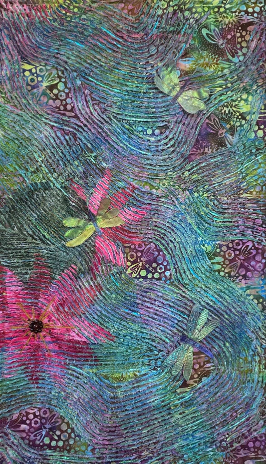 Still Waters: Dragonflies in the Morning by Miki Howell features a textile wall hanging with flowing waves of purple, green, and blue hues, highlighted with pink and red floral patterns. Subtle dragonfly motifs enhance the intricate, textured mixed media fabric background.