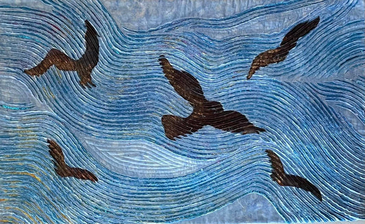 Soar: Art Quilt by Miki Howell showcases five dark birds flying above swirling blue lines, evoking movement and fluidity. Its textured, quilt-like design makes it an ideal choice for distinctive nature-inspired home decor.