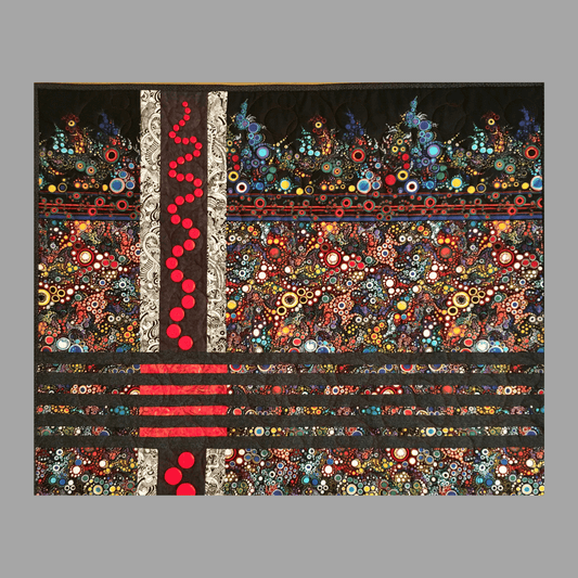 The Effervescent Sea: Quilted Wall Art by Mary Cantore features vibrant patterns—multicolored circles, swirls, and black and red lines—with a bold vertical red stripe and red dots on a gray quilted background.